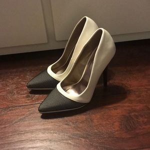 White stiletto heels with a mesh toe